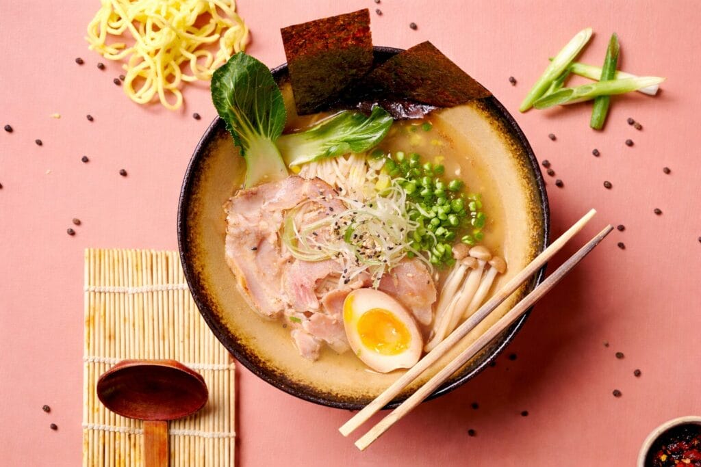 Shoyu ramen with chashu pork, soft boiled egg, noodles, mushrooms and green onions in light soy sauce broth.